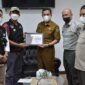 Sekdako Padang Panjang menyalurkan bantuan erupsi Gunung Semeru melalui ACT Bukittinggi