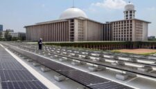 A technician inspects solar panels on the roof of Istiqlal grand mosque in Jakarta.<div class=
